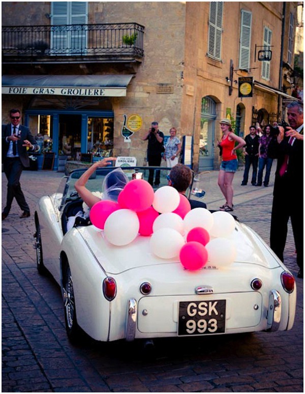 Vintage car with pink and white balloons