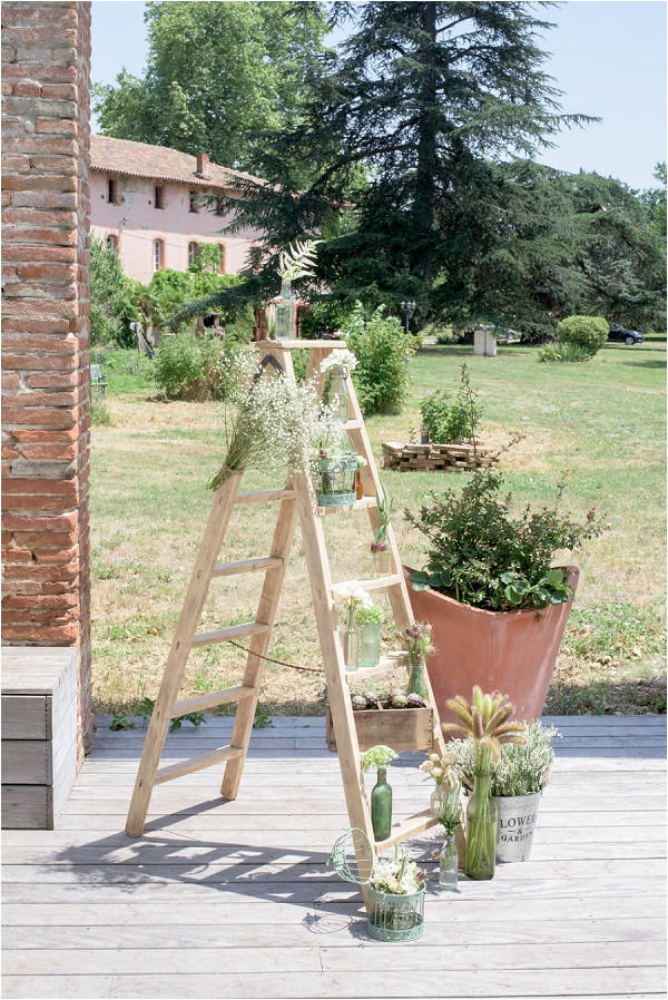 decorative wedding ladder and plants