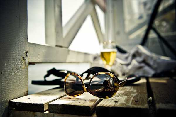 sunglasses, wine and sun © Janis Ratnieks Photography 