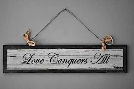 love conquers all sign