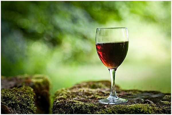 glass of red wine outdoors 