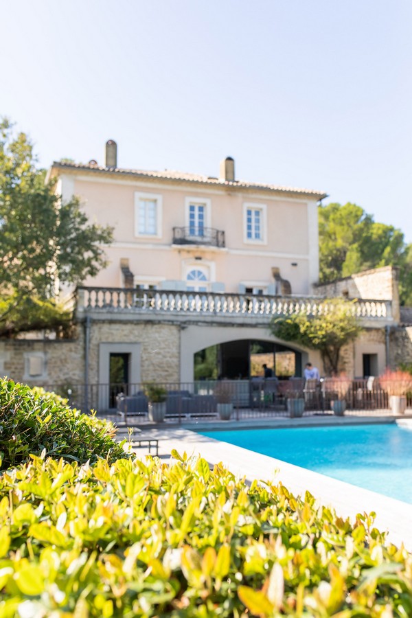 Pool and facade of Chateau La Tour Vaucros in France