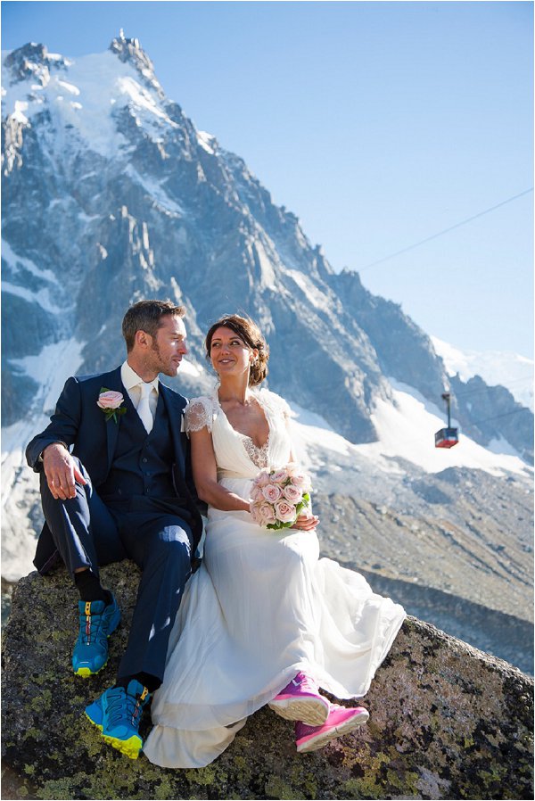 bride & groom with cable car in the background