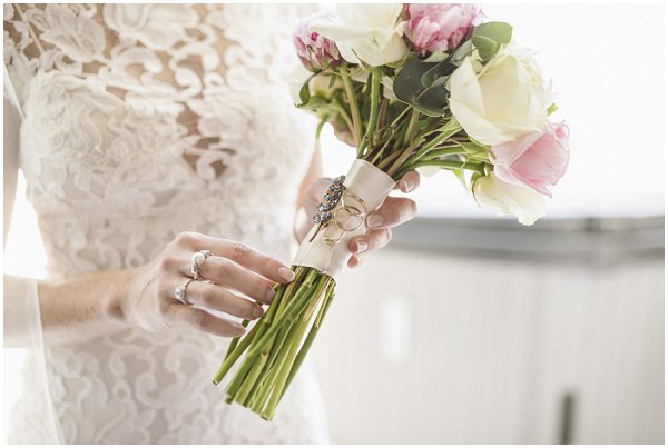 attaching jewels to wedding bouquet