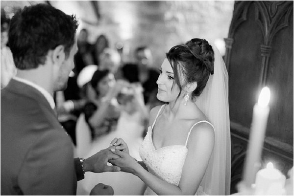 Beautiful Bride giving her groom his ring