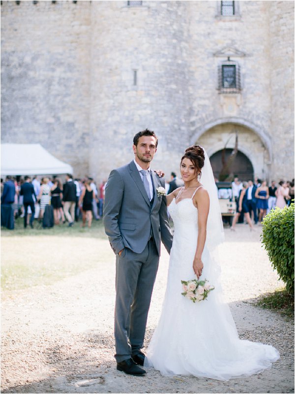Gorgeous bride and groom outside Chateau de Mauriac