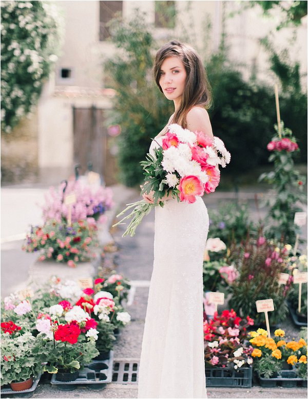 Bride chooses her own pink and white bouquet of peonies at Provencal market