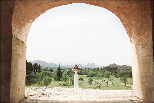 Bride stood in the sprawling grounds of Mas de la Rose in Provence