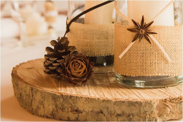Wooden log centrepiece complete with pine cones and candles
