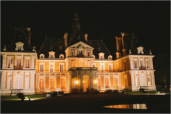 Chateau de Baronville exterior lit up at night