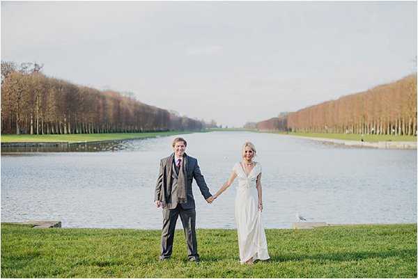 Holding hands by the lake at Versailles