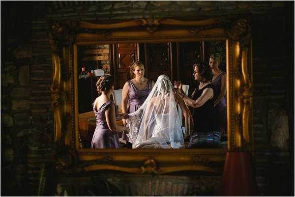 Reflections of the bridal party making last minute preparations