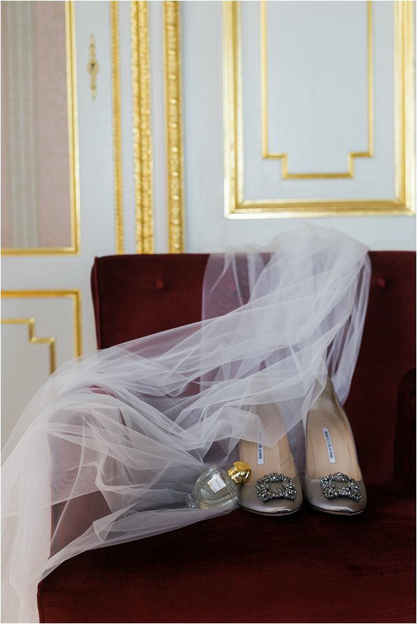 Silver buckle Manolo Blahnik shoes with wedding veil