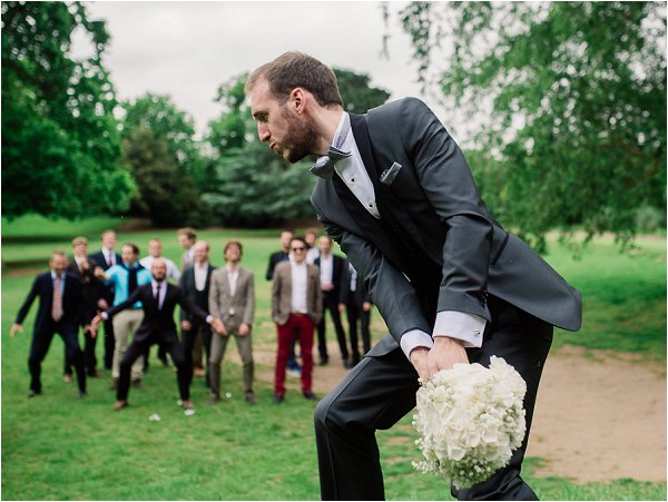 The groom throws the bouquet