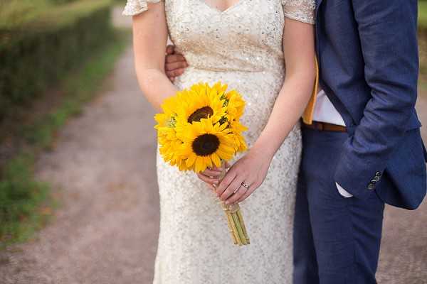 Grooms navy suit with yellow tie