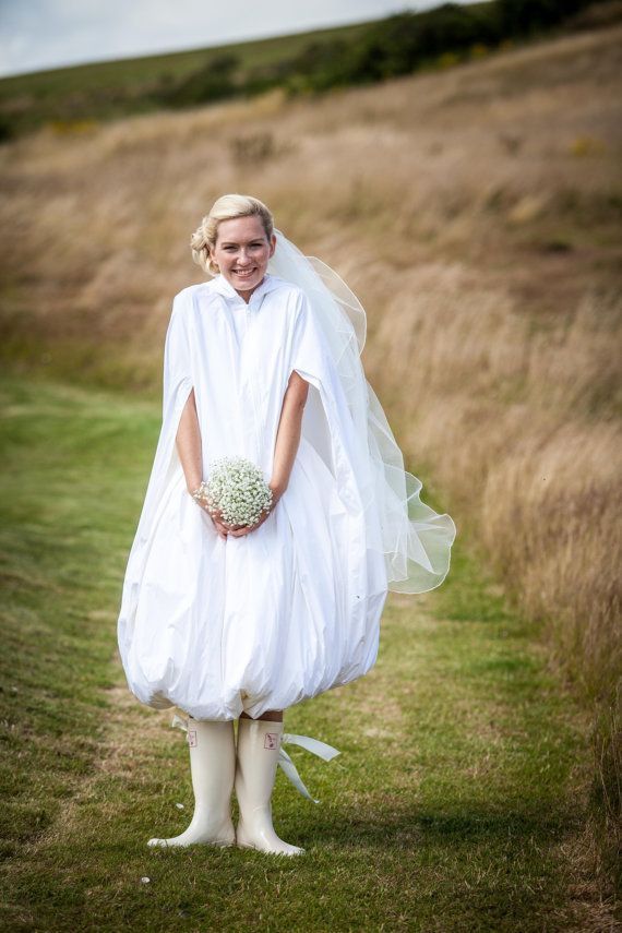 A waterproof bridal cloak to protect from rain, puddles and mudA waterproof bridal cloak to protect from rain, puddles and mud