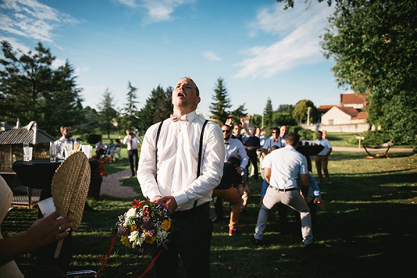 groom bouquet toss