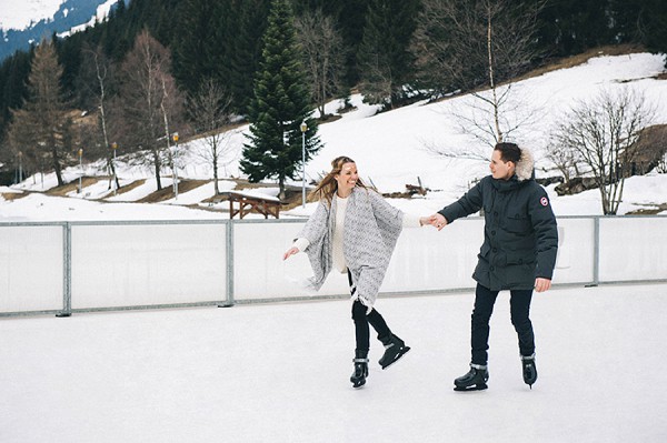 engaged couple ice skating 