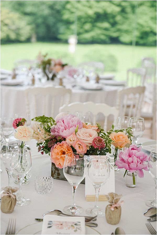 lovely flowers at the table in wedding at Château de Méridon