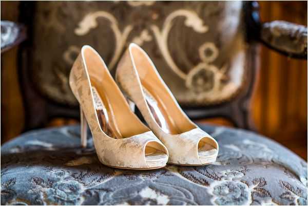 white embroidered bridal shoes at Chateau Challain by Janis Ratnieks Photography