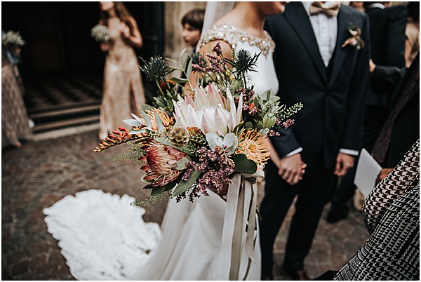 brides textured flowers leaving church