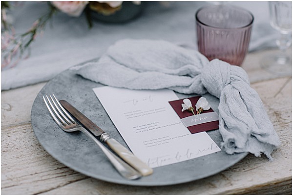 table top decor with blue napkin and bright stationary