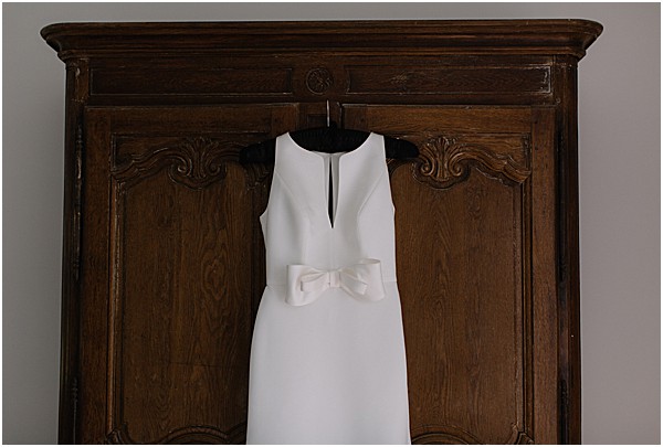 wedding gown on antique dresser