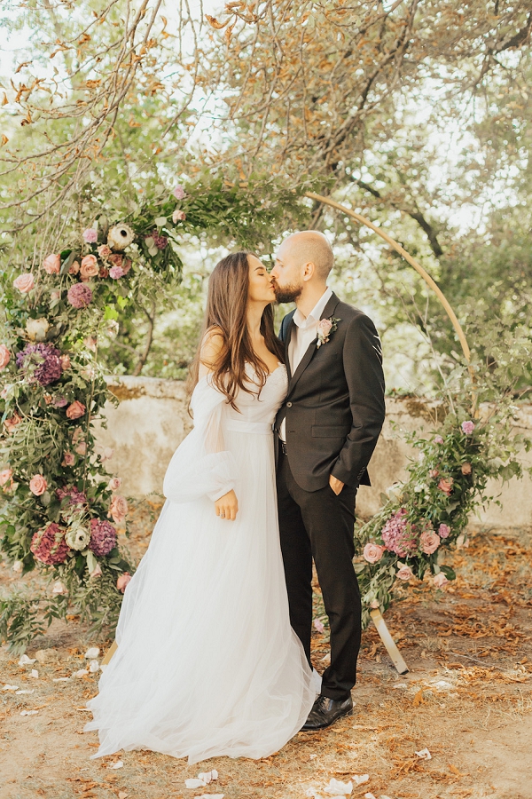 rose and hydrangea wedding arch