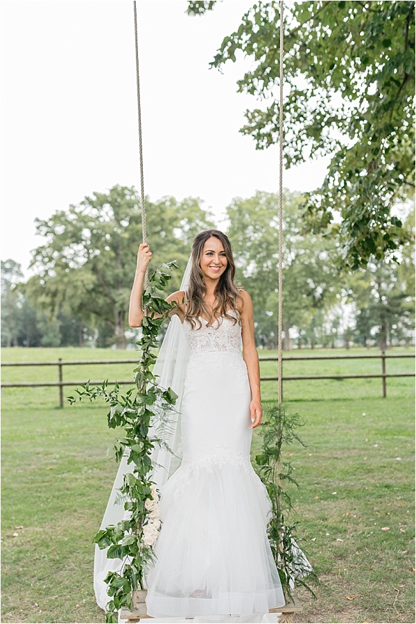 Love bridal boutique dress on swingset