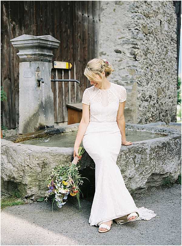 lace fitted bridal dress and fountain Images by Alexander J Collins