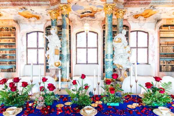 Beauty and the Beast wedding themed table setting with roses