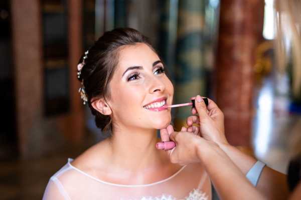 Bride has makeup done