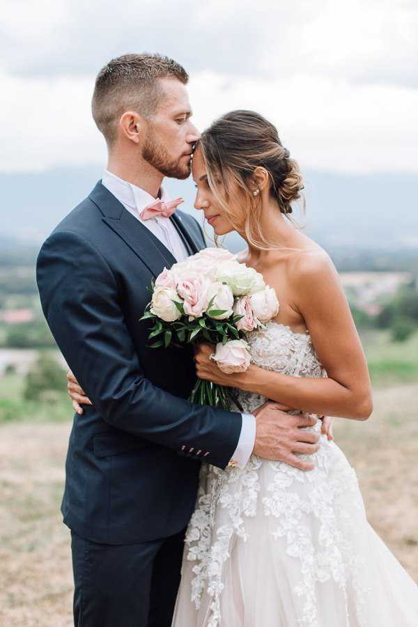 bride and groom kiss after getting married