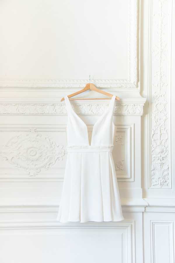 Brides Dress on Hanger against Detailed chateau wall