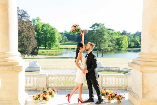 Couple kiss after exchanging vows at Chateau Rothschild