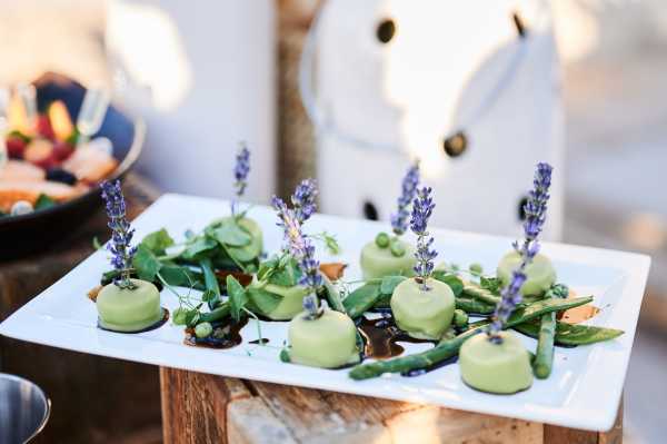 Pastel green hors d'oeuvres with lavender flowers