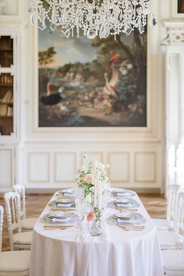 Wedding table at literary themed wedding between two book lovers inside Chateau de Baronville, France