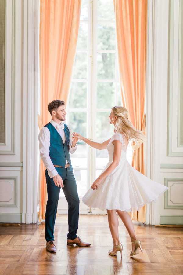 Bride and groom dance on parquet floors in Chateau de Baronville, France