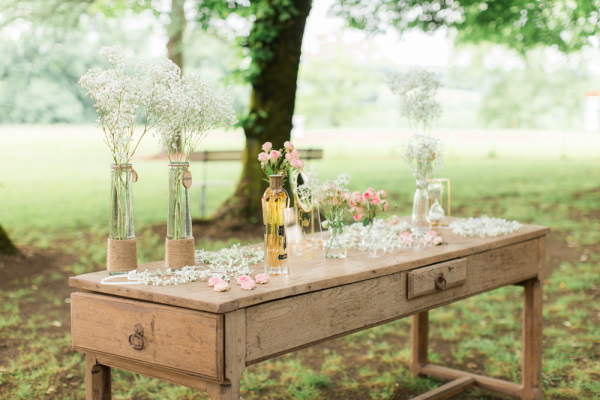 Wedding bar set up on old wooden desk in garden