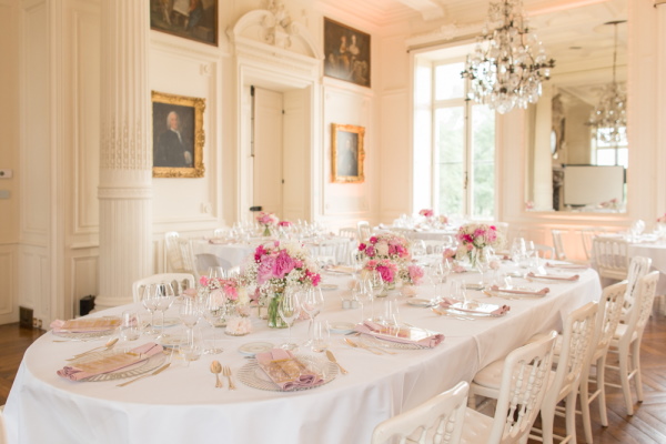 Indoor wedding table at Chateau d'Azy adorned with pink posies