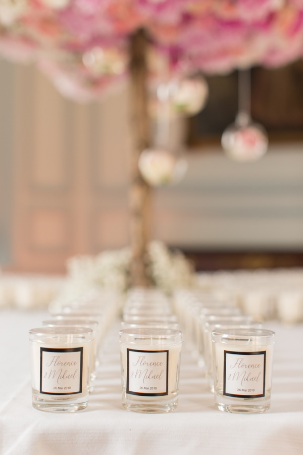 Wedding favours of rows of personalised jar candles