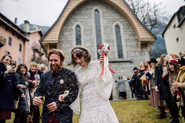 Wedding guests shower bride and groom in sustainable bird seed confetti