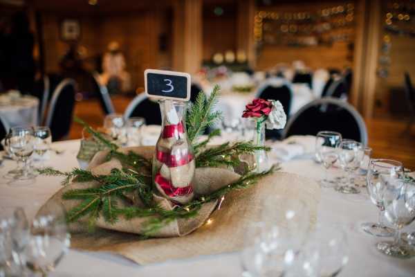 Wedding table decorations are made from collected and repurposed tree branches