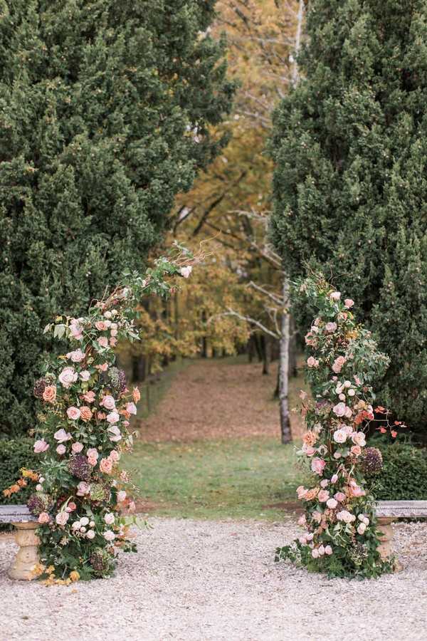 floral wedding arbor in garden