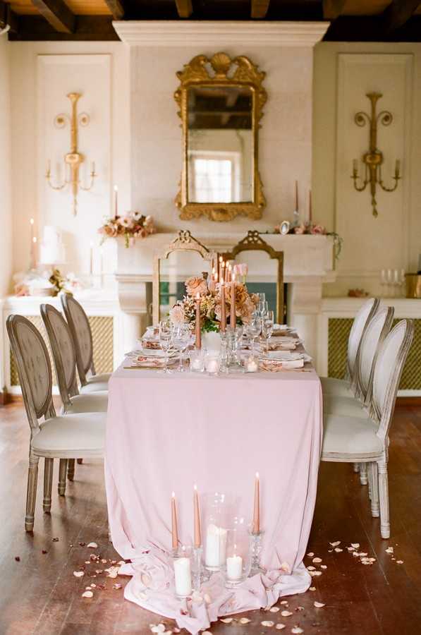 6 seater dining table with pink accents set up for a micro wedding a la francaise