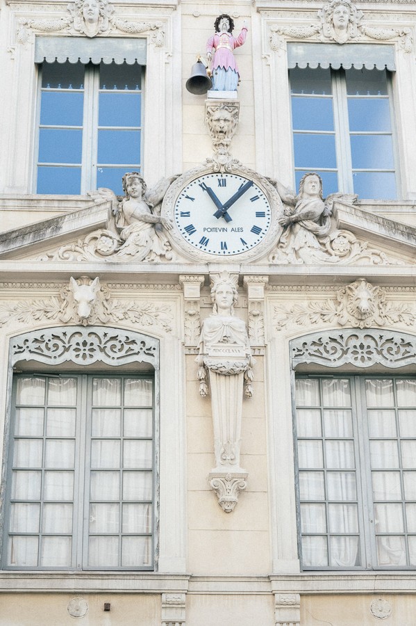 Clock displaying 11.05am on townhall in France