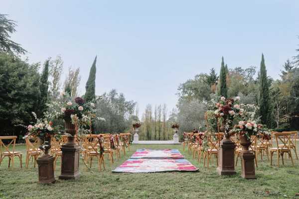 Chairs and carpeted aisle in the garden of Chateau Lacanaud in Dordogne France