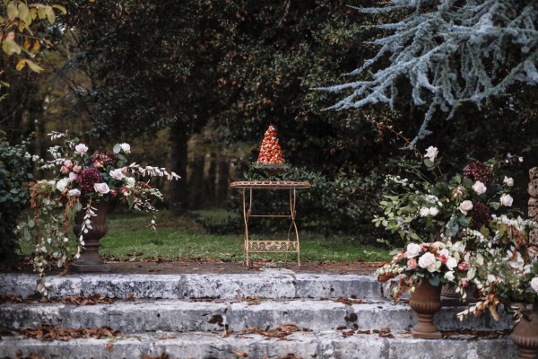 traditional french croquembouche at the top of the garden steps of chateau lacanaud