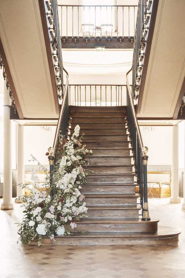 interior grand dark wood staircase of Chateau de Roquefoulet