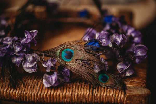 peacock feather and purple flower bridal crown